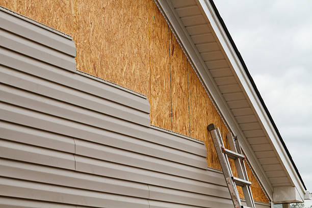 Professional Storm Damage Siding Repair technician working in Monroe, NC